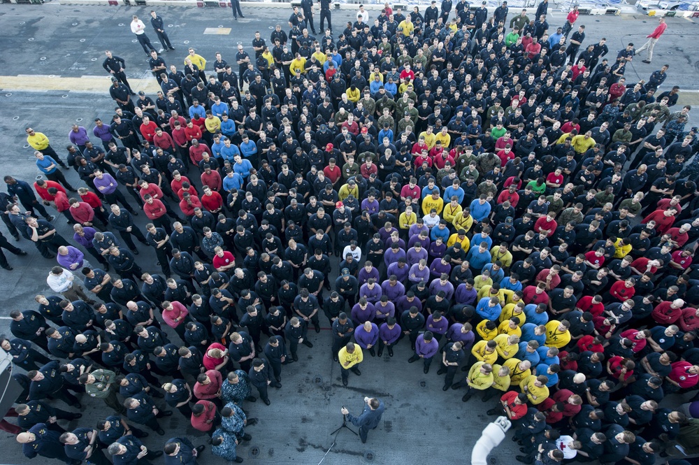 USS AMerica Sailor holds all hands call