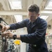 USS America (LHA 6) Sailor tests electrical equipment in the calibration lab