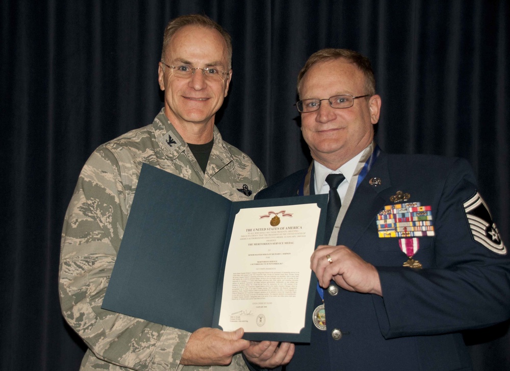Senior Master Sgt. Rick Simpson receives the Meritorius Service Medal