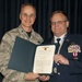 Senior Master Sgt. Rick Simpson receives the Meritorius Service Medal