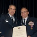 Senior Master Sgt. Rick Simpson receives his retirement certificate