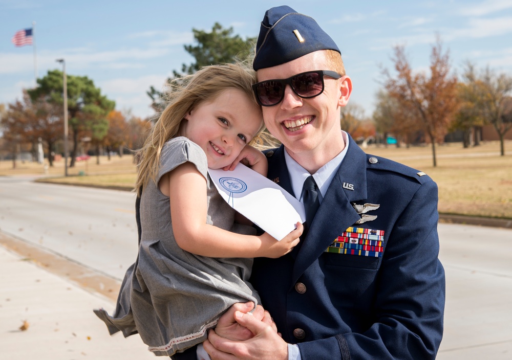 Pilot embraces daughter after graduation