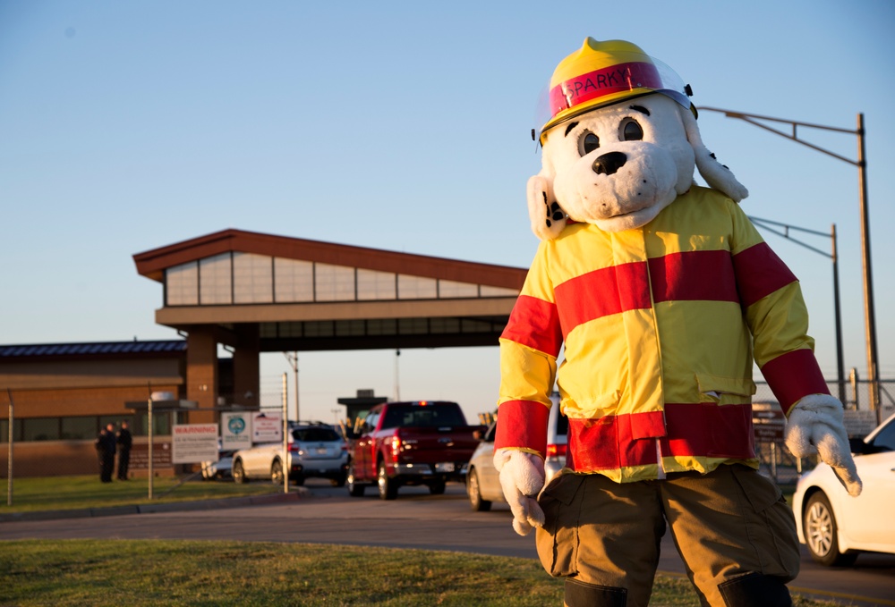 Sparky stands in front of Vance during Fire Prevention Week