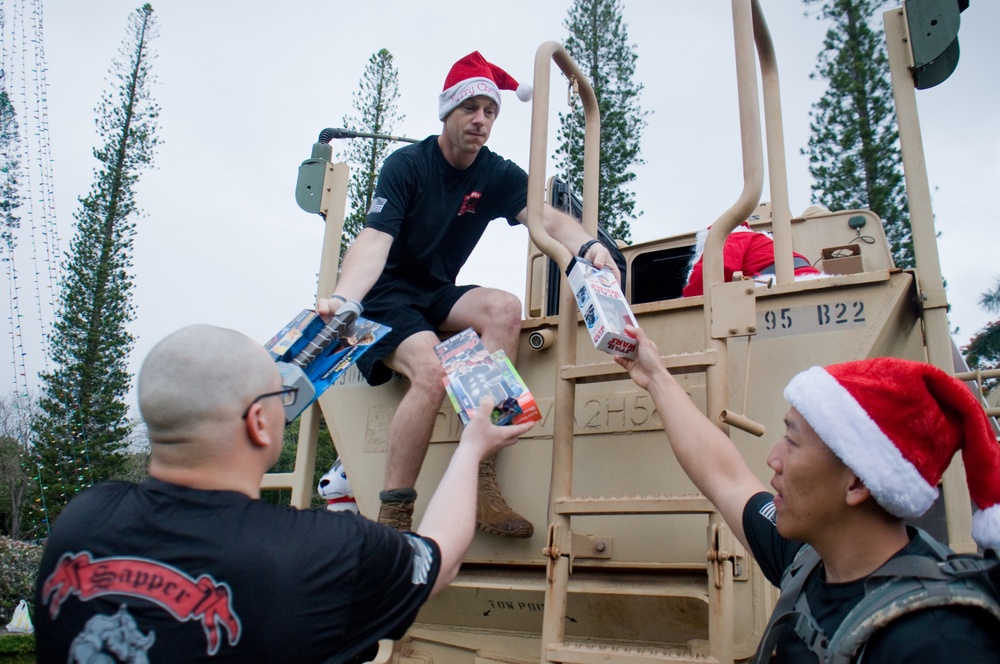 ‘Wolfpack’ holds Christmas ruck for children