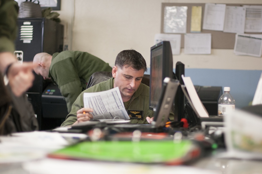 Marine Corps Capt. Nick Johnson from VMGR 252 does mission planning at Nevada Air National Guard Base, Reno, Nev.