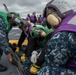 Sailors participate in drills on the flight deck.
