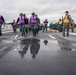 Sailors participate in drills on the flight deck.
