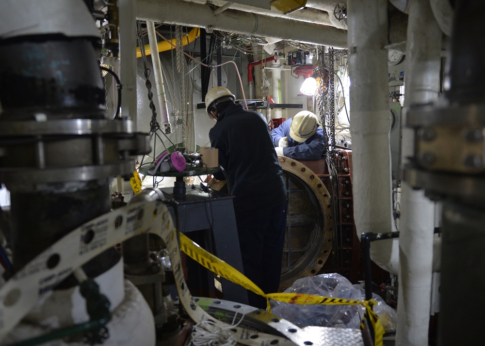 BLR engineers and SRF workers maintain integrity of ship's engineroom equipment.