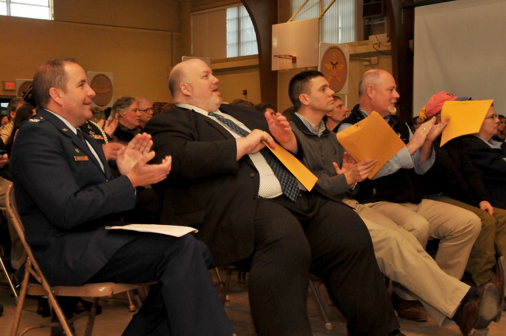 Col. Suhr commends new eagle scouts on a job well done.