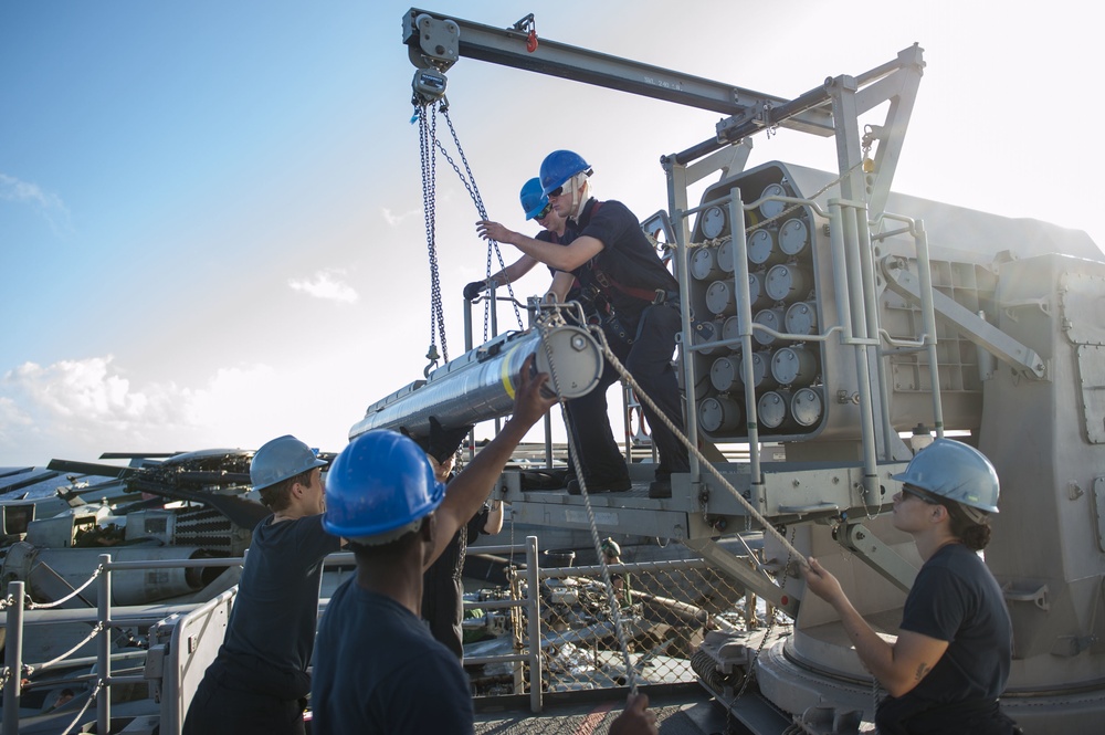 USS America (LHA 6) Sailors download the rolling airframe missile (RAM) system