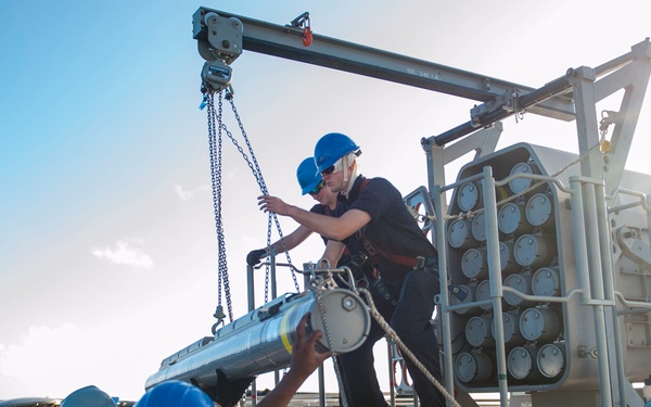 USS America (LHA 6) Sailors download the rolling airframe missile (RAM) system