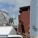 Crews work to dewater storm-impacted vessels in Palmas del Mar, Puerto Rico