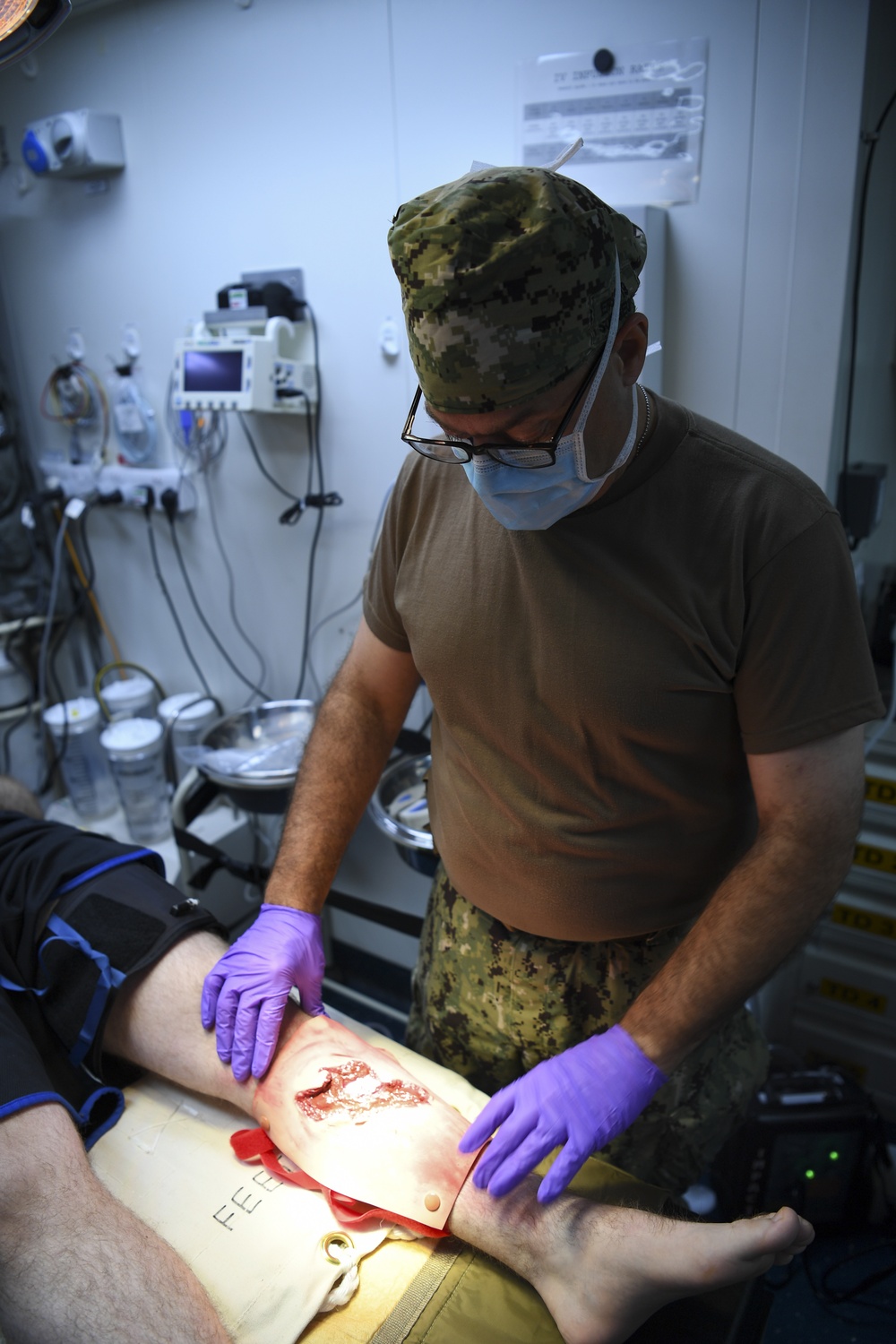 U.S. Navy and U.K. Royal Navy Sailors perform training on a Neil Robertson stretcher aboard Royal Fleet Auxiliary ship Cardigan Bay during exercise Azraq Serpent 18.