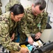 U.S. Navy and U.K. Royal Navy Sailors perform training on a Neil Robertson stretcher aboard Royal Fleet Auxiliary ship Cardigan Bay during exercise Azraq Serpent 18.