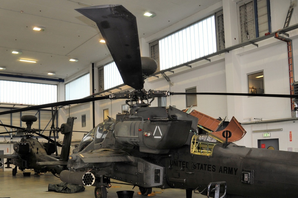 Apaches in the hangar for maintenance.