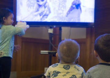 Military families enjoy a Winter Wonderland themed dinner aboard Camp Foster