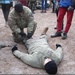 Latvian scouts learn first aid from Air Cav