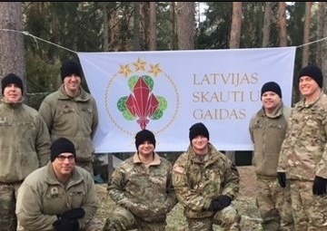 Latvian scouts learn first aid from Air Cav