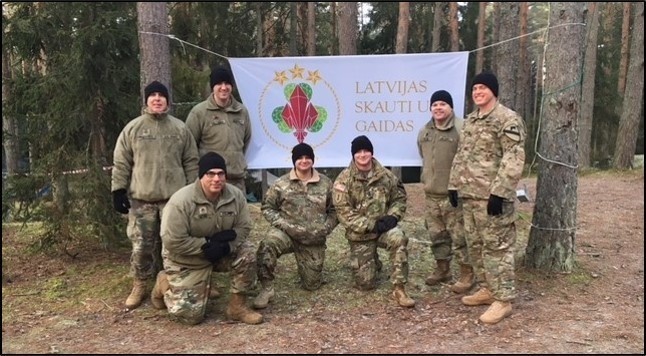 Latvian scouts learn first aid from Air Cav