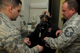 Lt. Michael J. Avalone &amp; Master Sgt. Jeffery D. Allard perform a mask fitting for Daniel Estee.