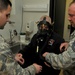 Lt. Michael J. Avalone &amp; Master Sgt. Jeffery D. Allard perform a mask fitting for Daniel Estee.