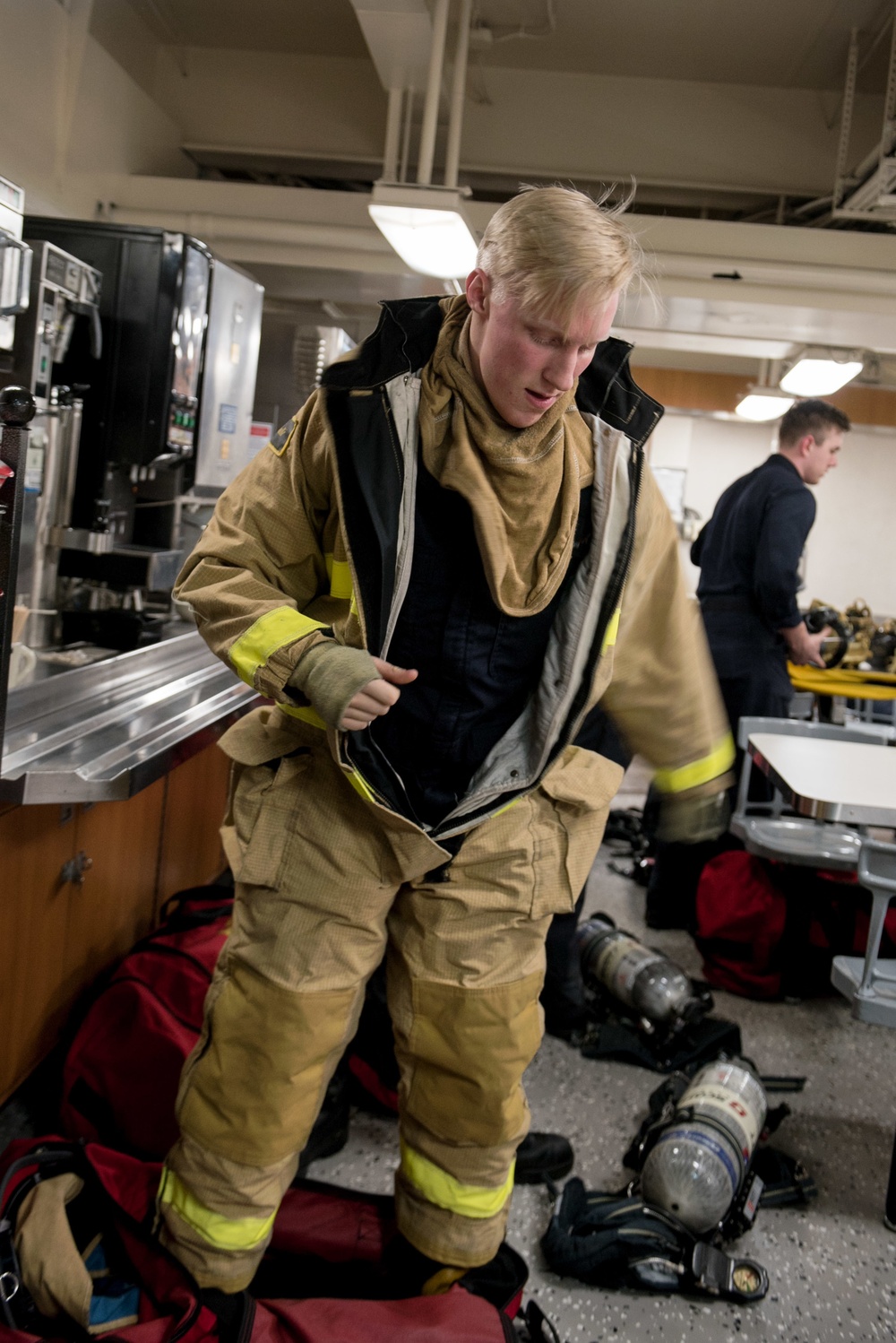 Sailors don firefighting ensembles