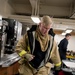 Sailors don firefighting ensembles