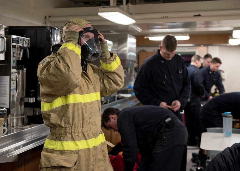 Sailors don firefighting ensembles