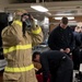 Sailors don firefighting ensembles