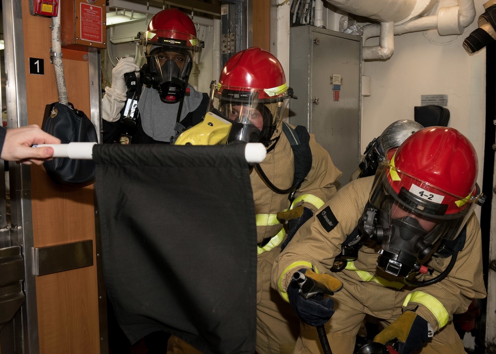 Sailors fight a simulated fire