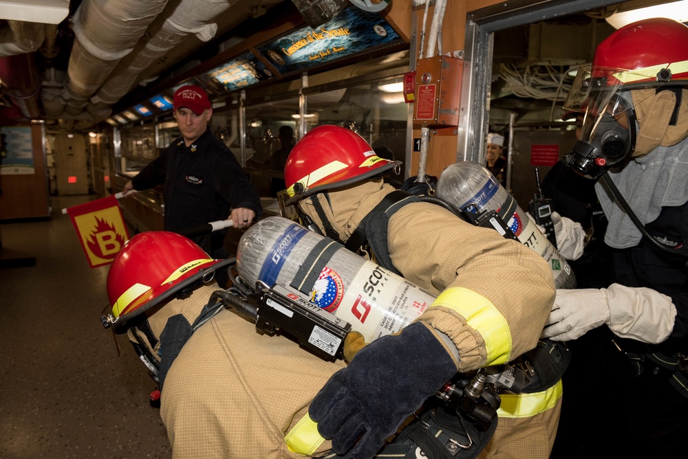 Sailors fight a simulated fire