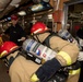 Sailors fight a simulated fire