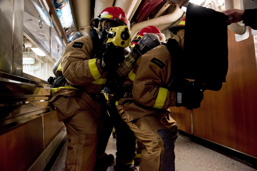 Sailors fight a simulated fire