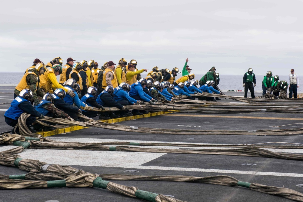 Sailors assember the emergency barricade on the flight deck