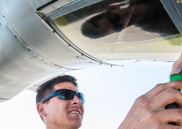 Airmen conduct maintenance on a KC-135 tanker