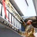 Airmen conduct maintenance on a KC-135 tanker