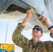 Airmen conduct maintenance on a KC-135 tanker