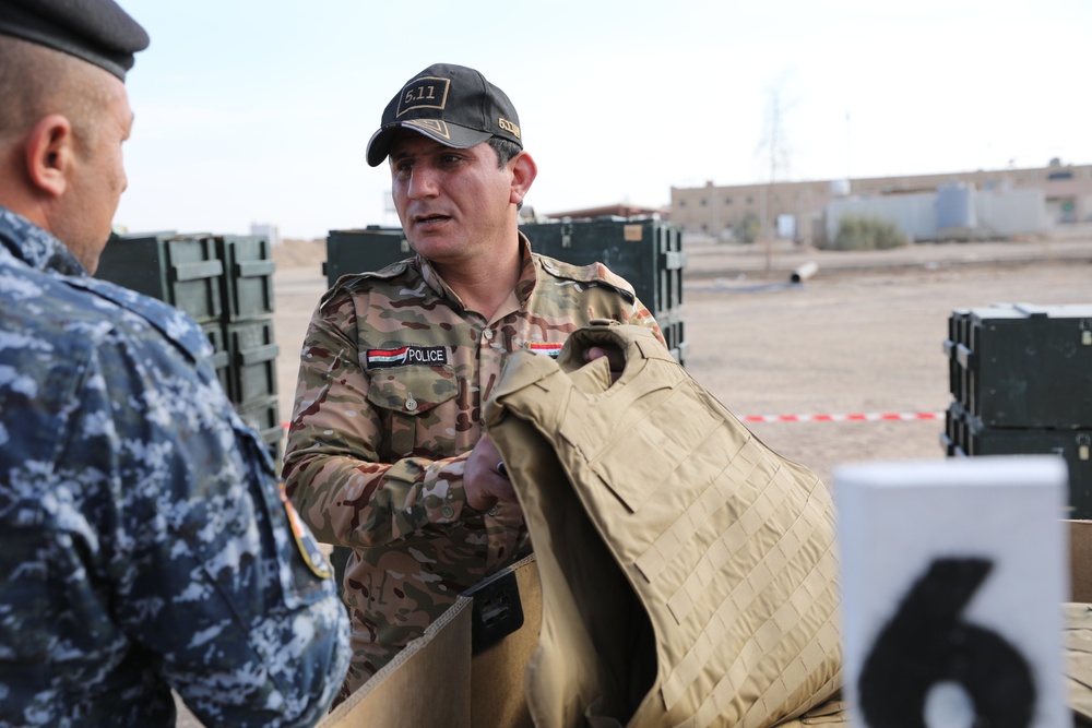 Iraqi Security Forces recieve organizational clothing and individual equipment from Coalition
