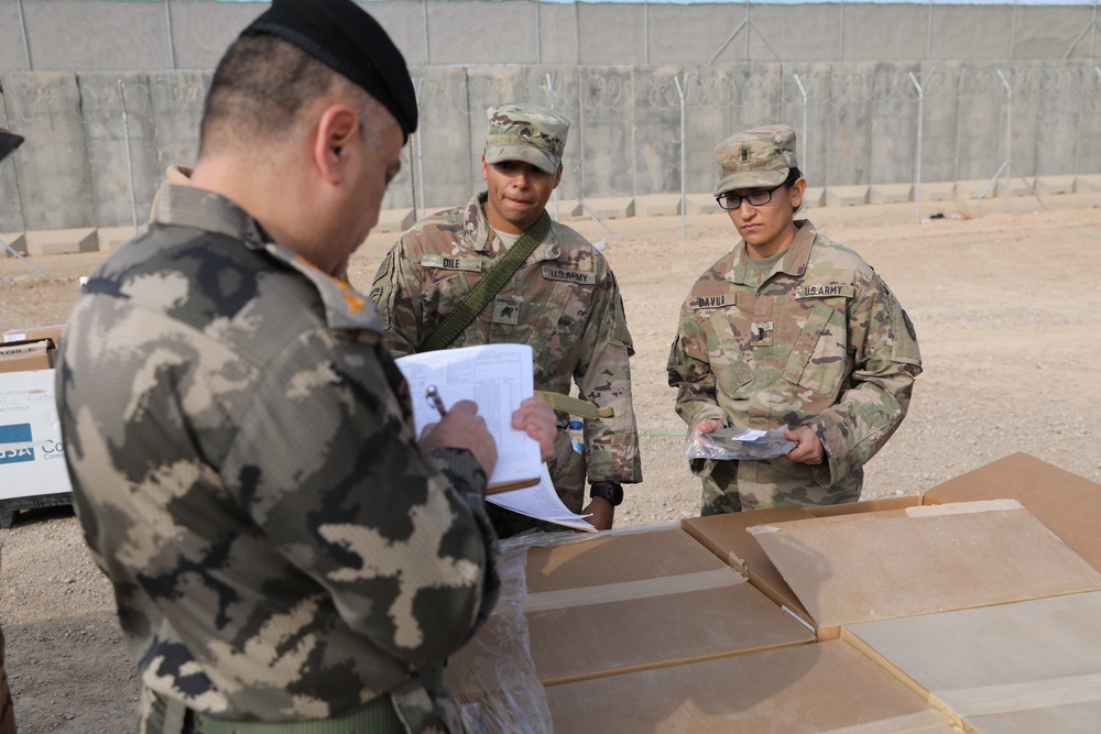 Iraqi Security Forces recieve organizational clothing and individual equipment from Coalition