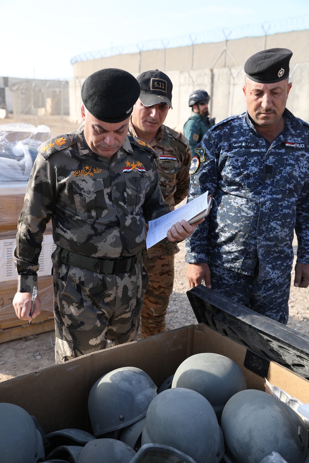 Iraqi Security Forces recieve organizational clothing and individual equipment from Coalition