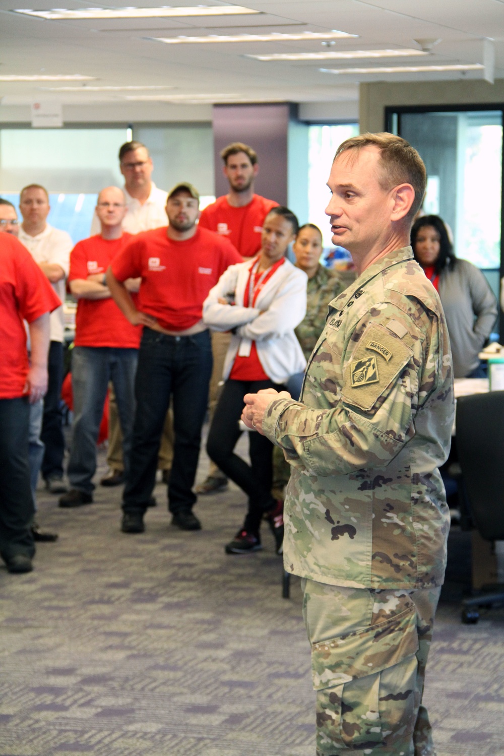 Recovery Field Office Commander speaks with team members