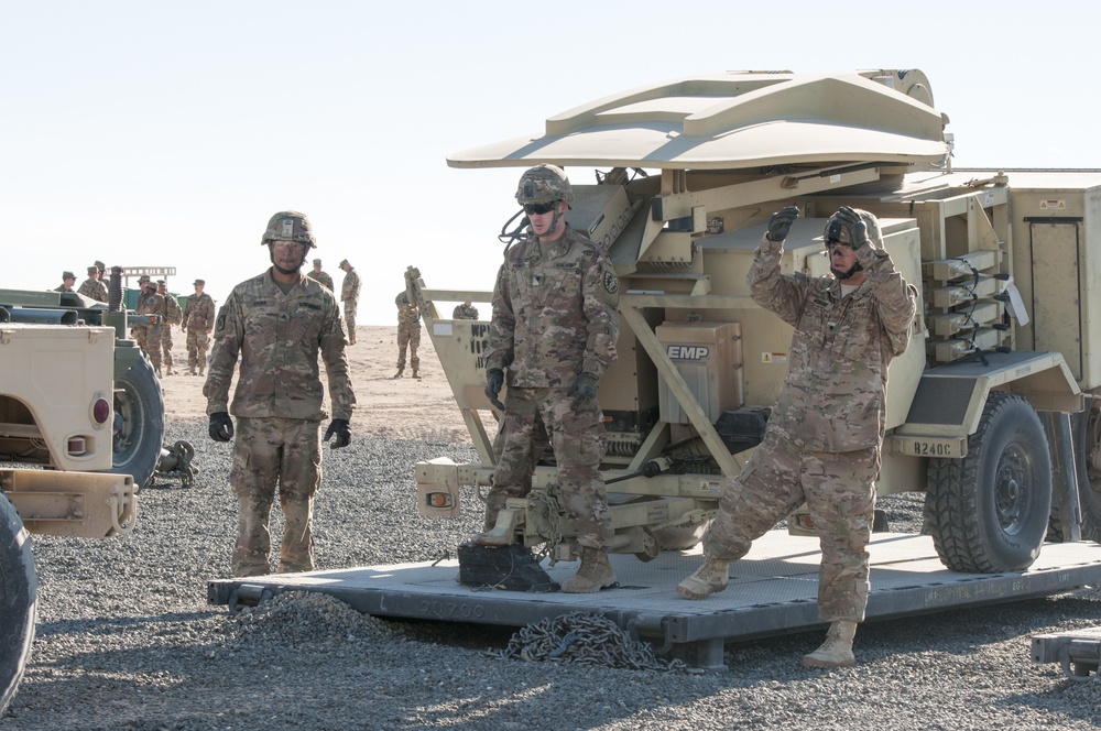 Transportation Soldiers unload signal equipment