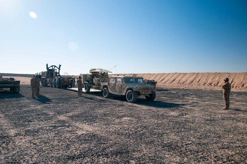 Signal, transportation Soldiers unload equipment during EDRE