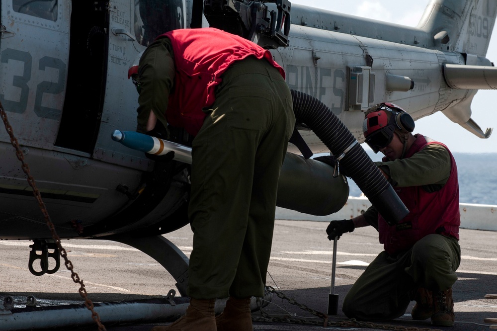 U.S. Marines Load Missles Into A Helicopter