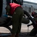 U.S. Marines Load Missles Into A Helicopter