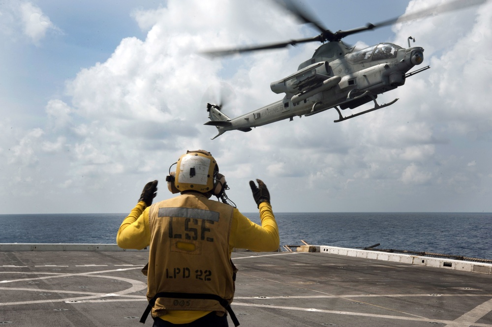 USS San Diego (LPD 22) Airman Directs a AH-1Z Viper Attack Helicopter