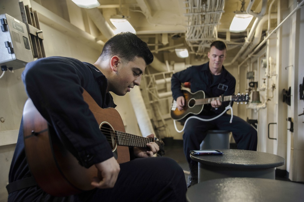 USS San Diego (LPD 22) Sailors Playing Guitar