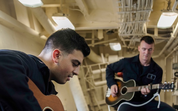 USS San Diego (LPD 22) Sailors Playing Guitar