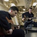 USS San Diego (LPD 22) Sailors Playing Guitar