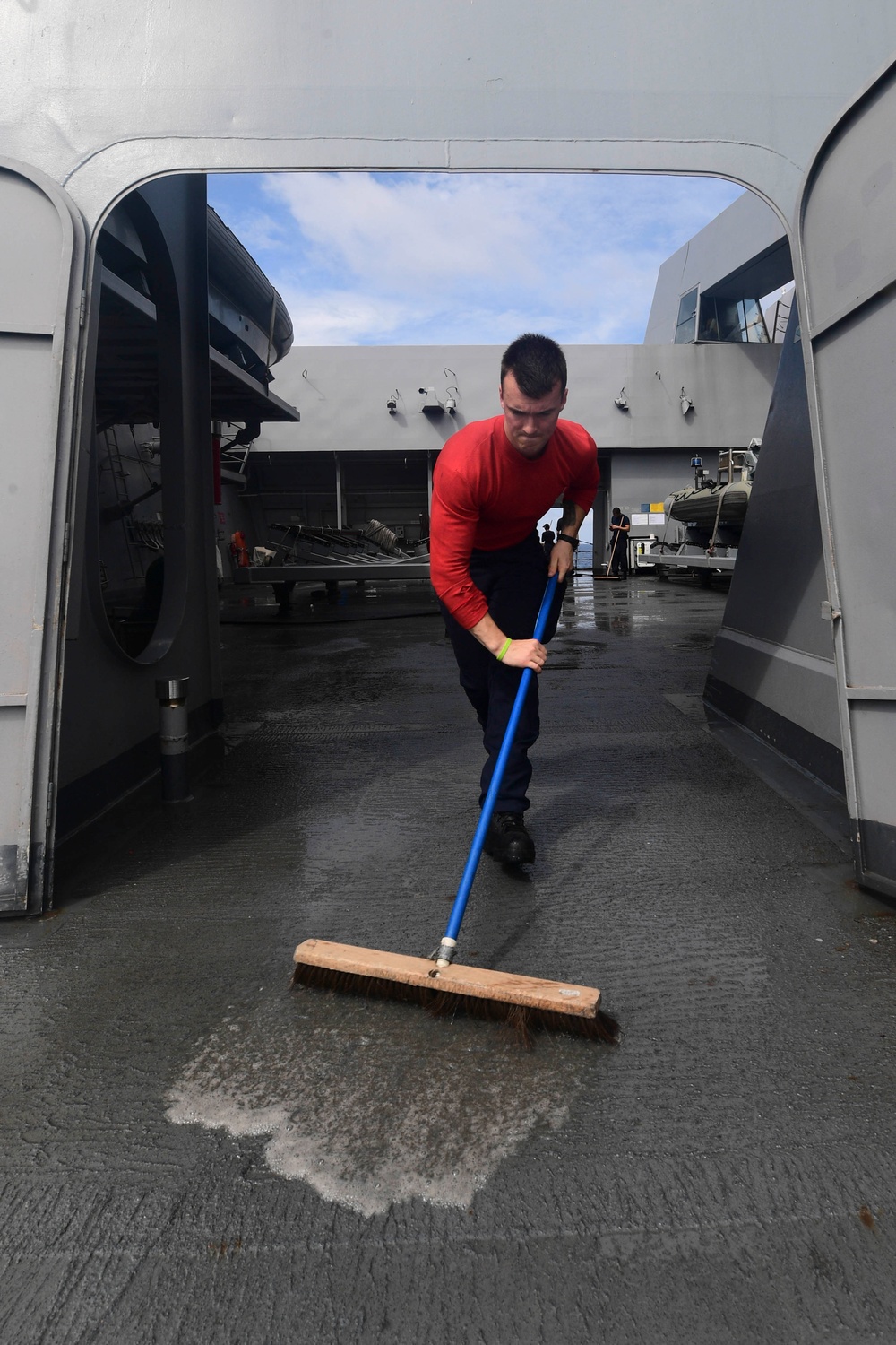 USS San Diego (LPD 22) Sailor Sweeps Water